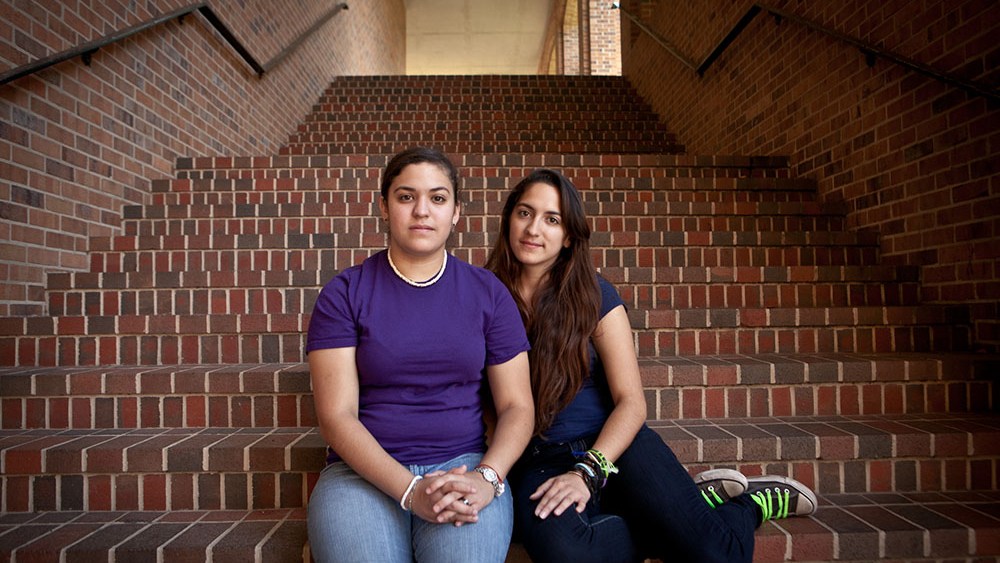 Left to Right: Twin sisters, Nicole and Victoria Rodriguez, pose for a portrait on the campus of where they attend school at St. Mary's University in San Antonio, Texas on May 14, 2013. (Photo by Erin Trieb for msnbc)