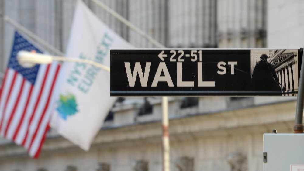 This Wednesday, Feb. 13, 2013 photo shows the Wall St. sign in New York. (AP Photo/Henny Ray Abrams)