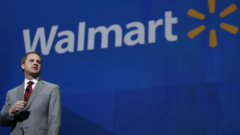 President and CEO, Walmart International Doug McMillan addresses the crowd on Wal-Mart 's 2012 worldwide sales during the Walmart shareholders meeting in Fayetteville, Ark., Friday, June 7, 2013. (AP Photo/Gareth Patterson)