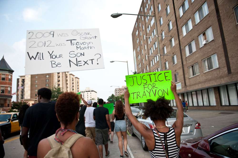 People march in Washington on July 19, 2013 during a demonstration against the acquittal of George Zimmermann in the killing of unarmed Florida teen Trayvon Martin. (Photo by Nicholas Kamm/AFP/Getty)