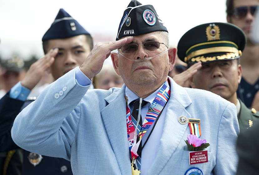 Roy Aldridge of the Korean War Veterans Association salutes during a ceremony to commemorate the 60th anniversary of the signing of the Armistice that ended the Korean War, at the Korean War Veterans Memorial in Washington, DC, July 27, 2013. (Photo by...