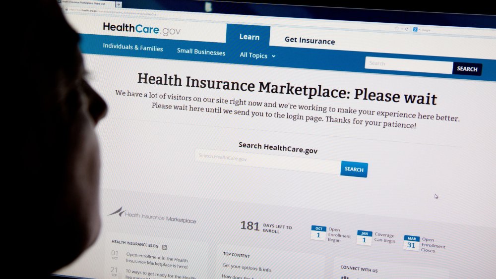 A woman looks at the HealthCare.gov insurance exchange, October 1, 2013 file photo.