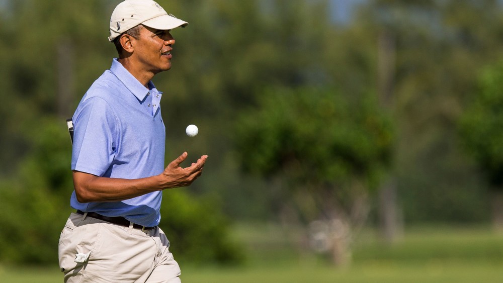 President Barack Obama walks on the second hole green at the Kaneohe Klipper Golf Course at Marine Corps Base Hawaii on January 2, 2014 in Kaneohe, Hawaii.