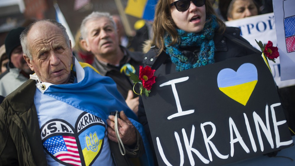 Demonstrators stand with placards and chant during a rally against Russian aggression in the Ukraine in front of the White House in Washington, D.C., March 6, 2014.