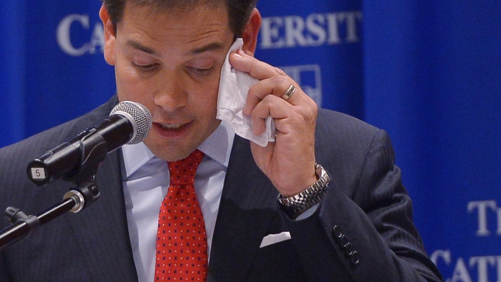 Senator Marco Rubio, R-FL, wipes his brow as he speaks during a discussion on the American family and cultural values." at Catholic University on July 23, 2014 in Washington, D.C.