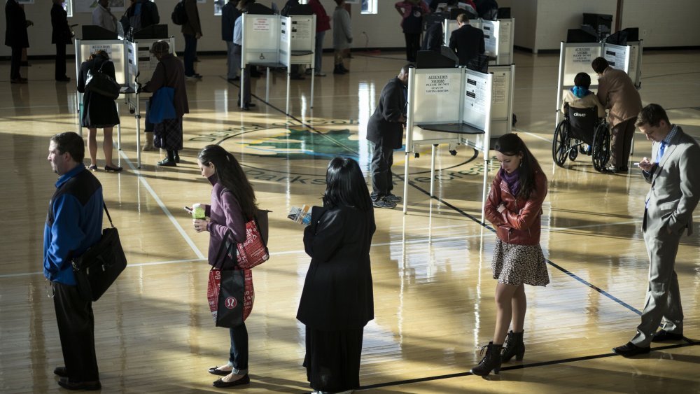 Voters cast their ballots while others wait their turn at the Kennedy Recreation Center on Nov. 4, 2014 in Washington, DC.