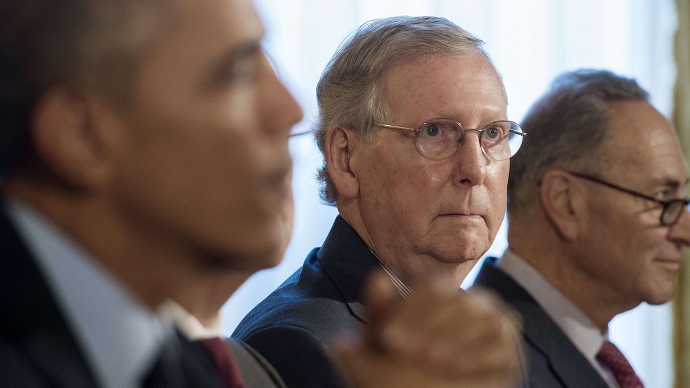 Senate Minority Leader Mitch McConnell and US Senator Chuck Schumer look on as US President Barack Obama speaks during a bipartisan, bicameral congressional leadership luncheon at the White House ion Nov. 7, 2014. (Jim Watson/AFP/Getty)