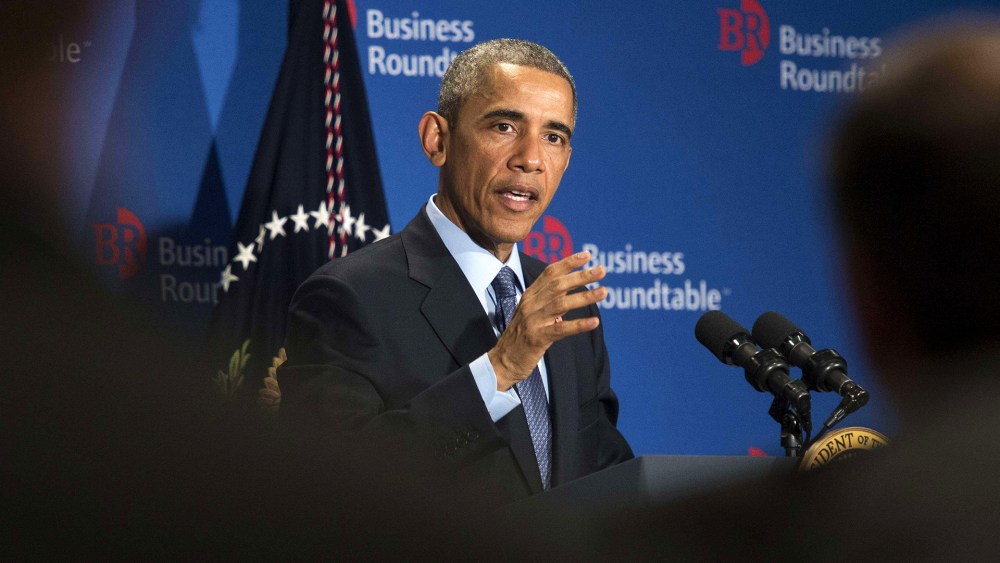President Barack Obama addresses a group of business leaders at the quarterly meeting of the Business Roundtable in Washington, D.C. on Dec. 3, 2014. (Photo by Nicholas Kamm/AFP/Getty)