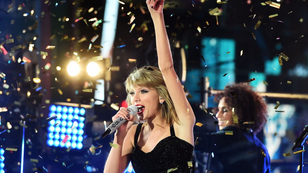 US singer Taylor Swift performs during New Years Eve celebrations in Times Square in New York on Dec. 31, 2014. (Photo by Jewel Samad/AFP/Getty)