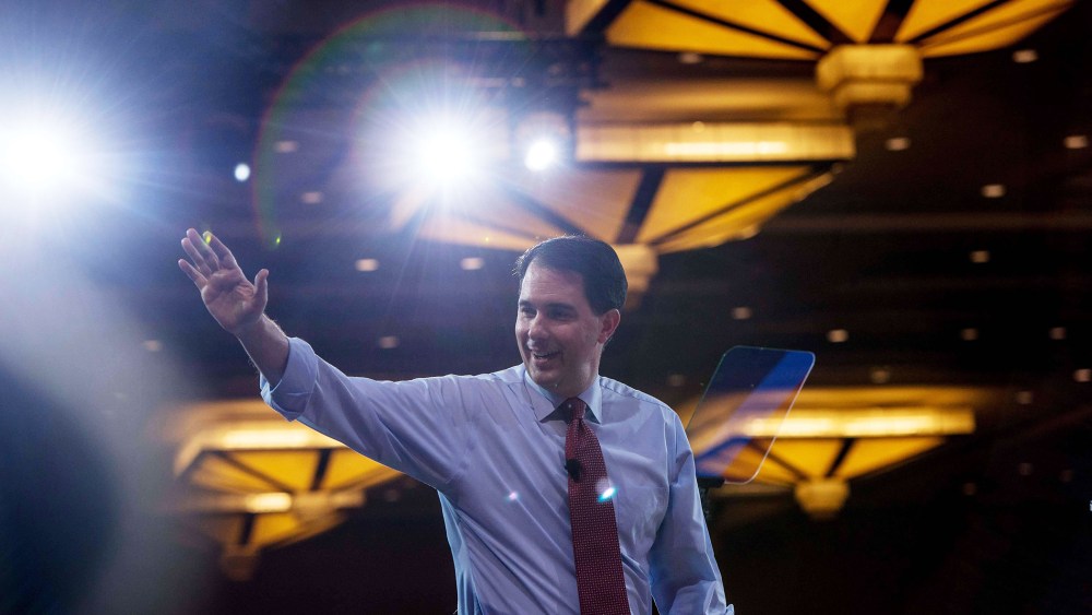 Wisconsin Governor Scott Walker walks off stage after speaking at the annual Conservative Political Action Conference (CPAC) at National Harbor, Maryland, outside Washington, on Feb. 26, 2015
