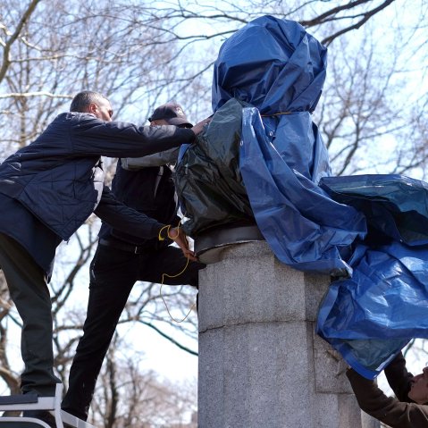 New York City Department of Parks and Recreation employees take down a statue of former National Security Agency (NSA) contractor Edward Snowden at the Fort Greene Park in Brooklyn, New York, on April 6, 2016.