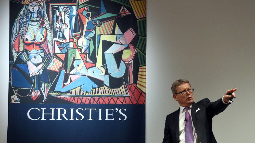 Auctioneer Jussi Pylkkanen takes bids on the Picasso masterpiece "Les Femmes d'Alger (Version O)" at Christie's in New York City on May 11, 2015. (Photo by Timothy A. Clary/AFP/Getty)