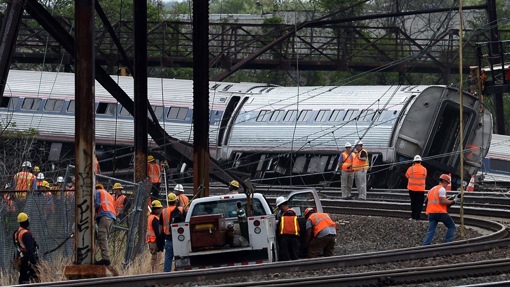 Rescuers work around derailed carriages of an Amtrak train in Philadelphia, Pennsylvania, on May 13, 2015. (Photo by Jewel Samad/AFP/Getty)