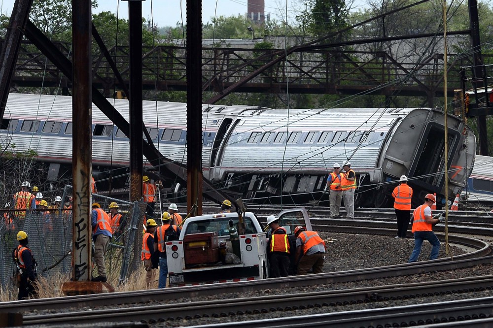 Rescuers work around derailed carriages of an Amtrak train in Philadelphia, Pennsylvania, on May 13, 2015. (Photo by Jewel Samad/AFP/Getty)