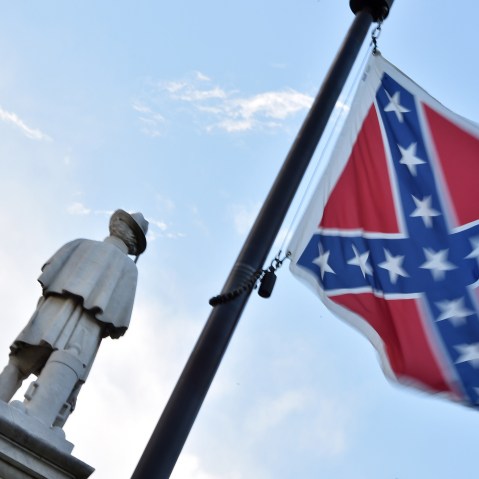 The Confederate flag is seen next to the monument of the victims of the Civil War in Columbia, S.C., on June 20, 2015. (Photo by Mladen Antonov/AFP/Getty)