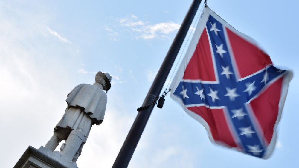 The Confederate flag is seen next to the monument of the victims of the Civil War in Columbia, S.C., on June 20, 2015. (Photo by Mladen Antonov/AFP/Getty)