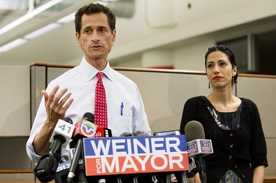 New York mayoral candidate Anthony Weiner speaks during a news conference alongside his wife Huma Abedin at the Gay Men's Health Crisis headquarters, Tuesday, July 23, 2013, in New York. The former congressman says he's not dropping out of the New York...