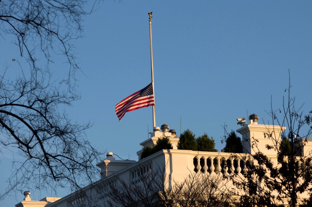 An American flag flies at half-staff over the White House in Washington, Friday, in honor of the Connecticut elementary school shooting victims. (AP Photo/Charles Dharapak)