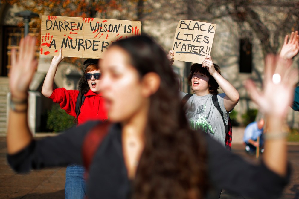 Demonstrators participate in a nationwide "Hands Up, Walk Out" protest at Boston University in Boston, Mass., Dec. 1, 2014. (Brian Snyder/Reuters)