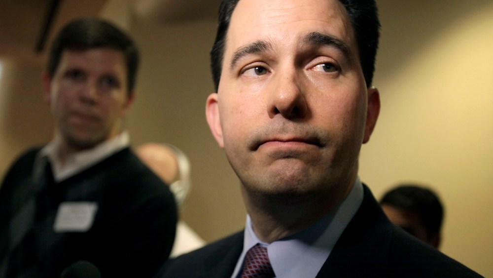 Wisconsin Gov. Scott Walker listens to a question while speaking with media about his proposed reforms to Medicaid, unemployment compensation, and food stamps, at Business Day in Madison. (AP Photo/Wisconsin State Journal, M.P. King)
