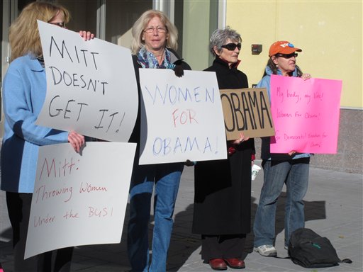 In this Oct. 24, 2012 photo, women backing President Obama protest outside a convention center in Reno where Republican Mitt Romney was giving a campaign speech. (AP Photo/Scott Sonner)