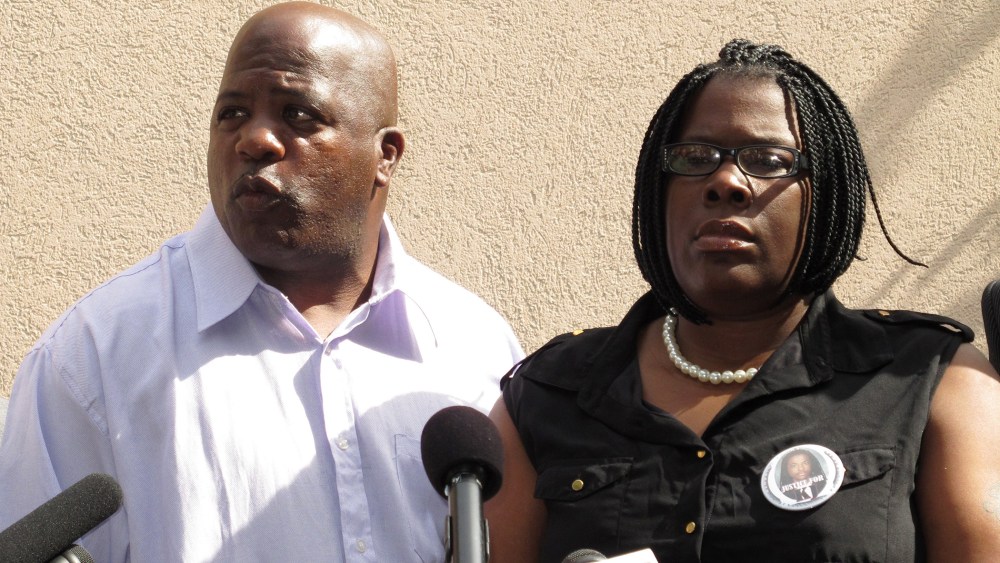Kenneth and Jacquelyn Johnson, whose son Kendrick was found dead in a wrestling mat, appear at a press conference on Thursday, Oct. 31 2013 in Tallahassee, Fla.