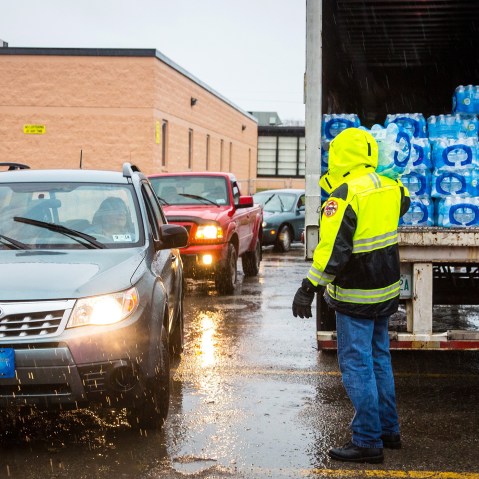 Lines formed early Saturdayas local residents in Kanawha County (W.Va.) flocked to distribution centers to load up on bottled water, Jan. 11, 2014.