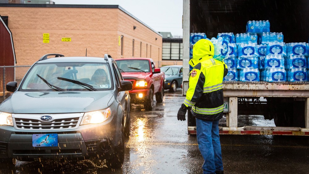 Lines formed early Saturdayas local residents in Kanawha County (W.Va.) flocked to distribution centers to load up on bottled water, Jan. 11, 2014.