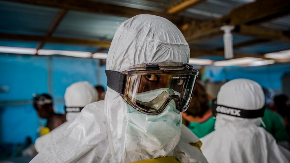 Doctors Without Borders workers suit up in protective clothing before entering an Ebola ward at the Elwa Hospital in Monrovia, Liberia. (Daniel Berehulak/The New York Times/Redux)