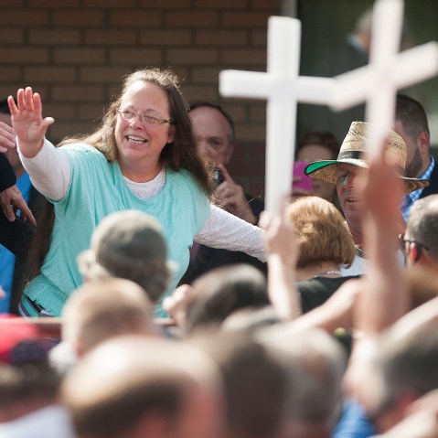 Rowan County Clerk of Courts Kim Davis waves to a crowd of her supporters at a rally in front of the Carter County Detention Center on Sept. 8, 2015 in Grayson, Ky.