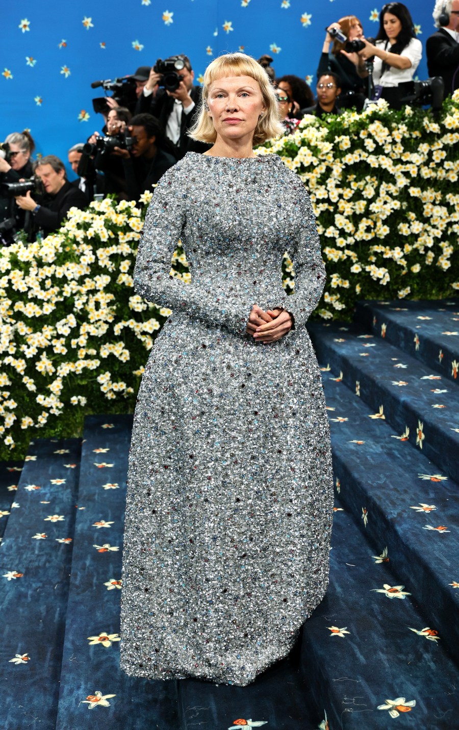 Pamela Anderson glitters on the Met Gala carpet.