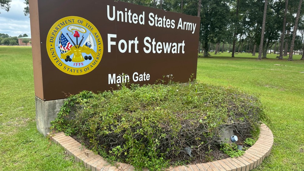 A sign outside that says "United States Army Fort Stewart"