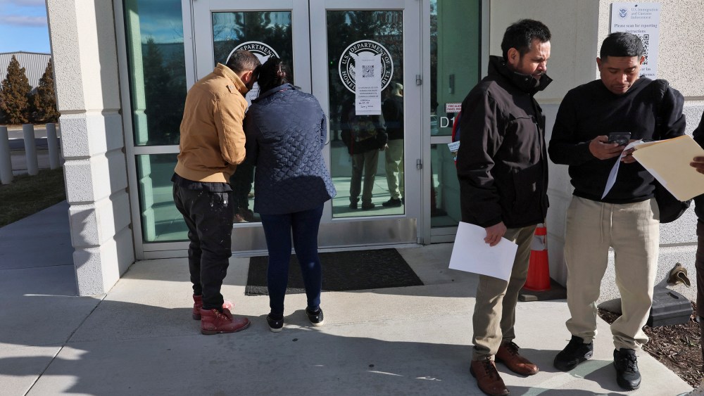 People arrive for appointments at U.S. Immigration and Customs Enforcement (ICE) in Chantilly, Virginia.