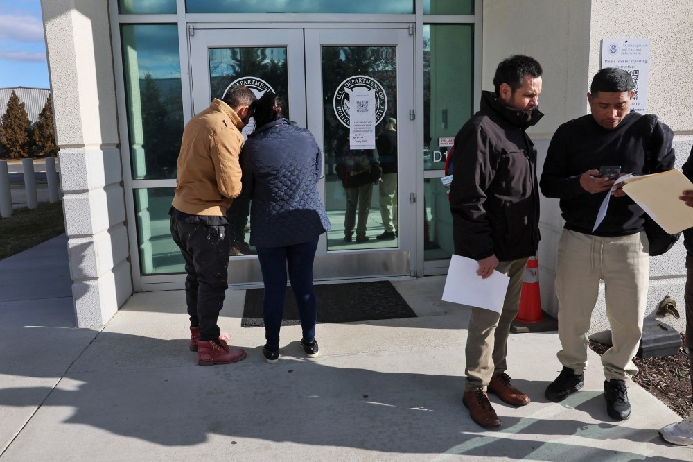 People arrive for appointments at U.S. Immigration and Customs Enforcement (ICE) in Chantilly, Virginia.
