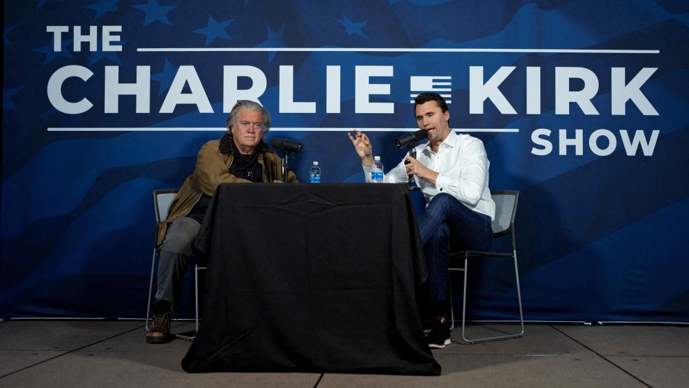Charlie Kirk conducts a live podcast with Steve Bannon during the AmericaFest 2024 conference  in Phoenix, Ariz., on Dec. 19, 2024.
