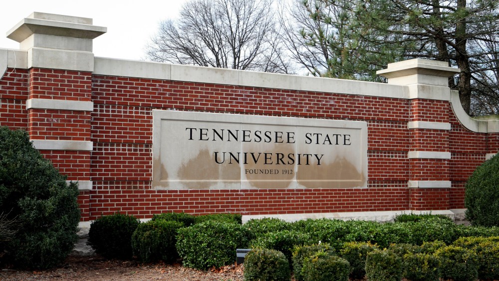 The sign for Tennessee State University on a brick facade outside