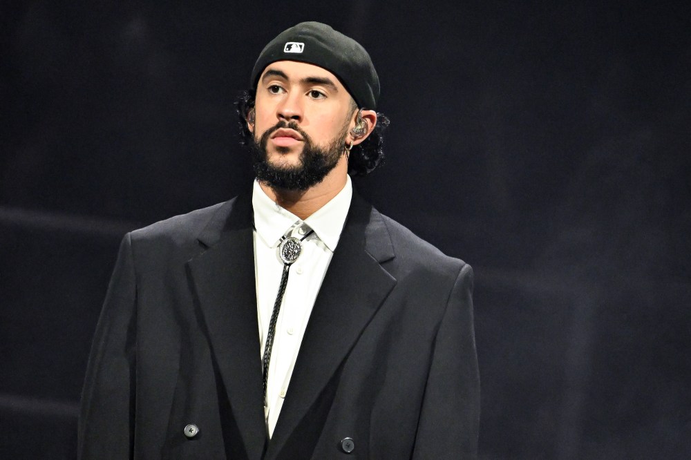 Bad Bunny stands onstage