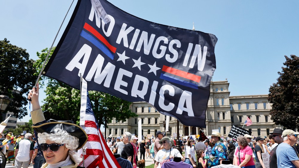 People take part in a "No Kings" protest.