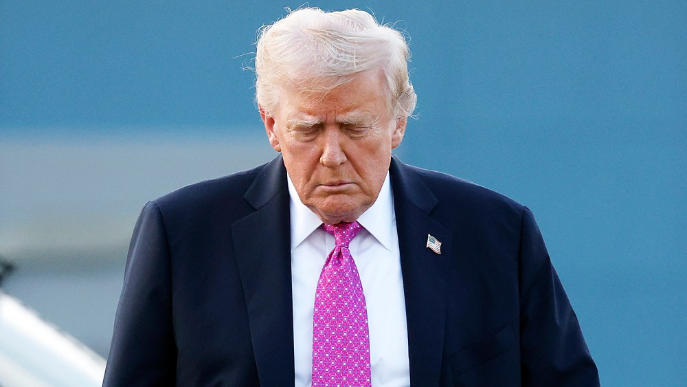 U.S. President Donald Trump looking down.