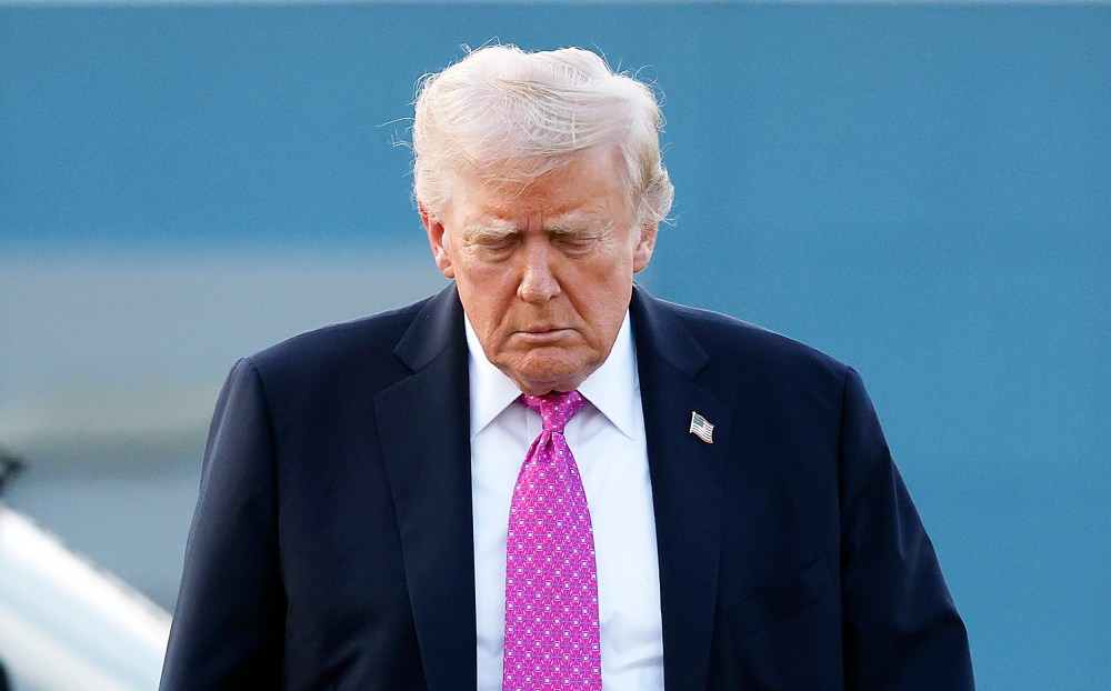 U.S. President Donald Trump looking down.