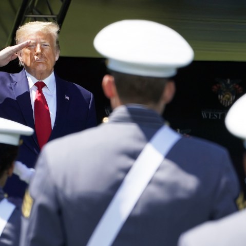 US President Donald Trump salutes cadets at a US Military Academy graduation ceremony.