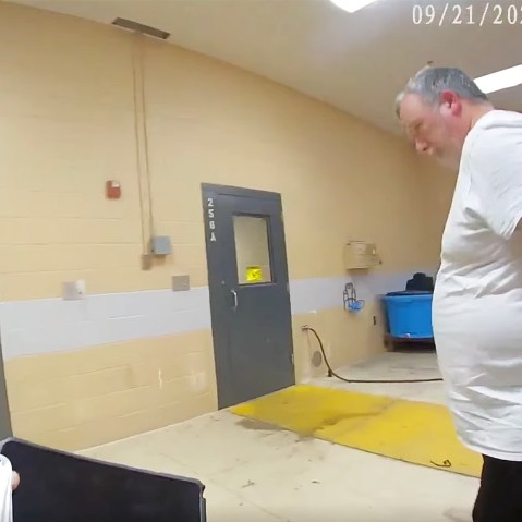 Larry Bushart in handcuffs from the police body cam footage.