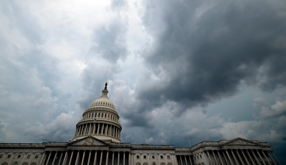 Storm clouds hover over the U.S. Capitol.