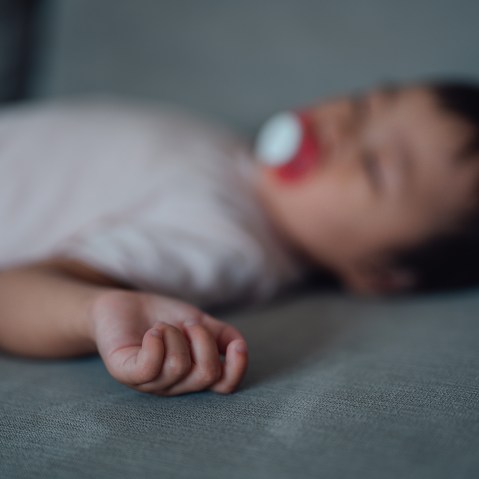 A sleeping baby, out of focus.