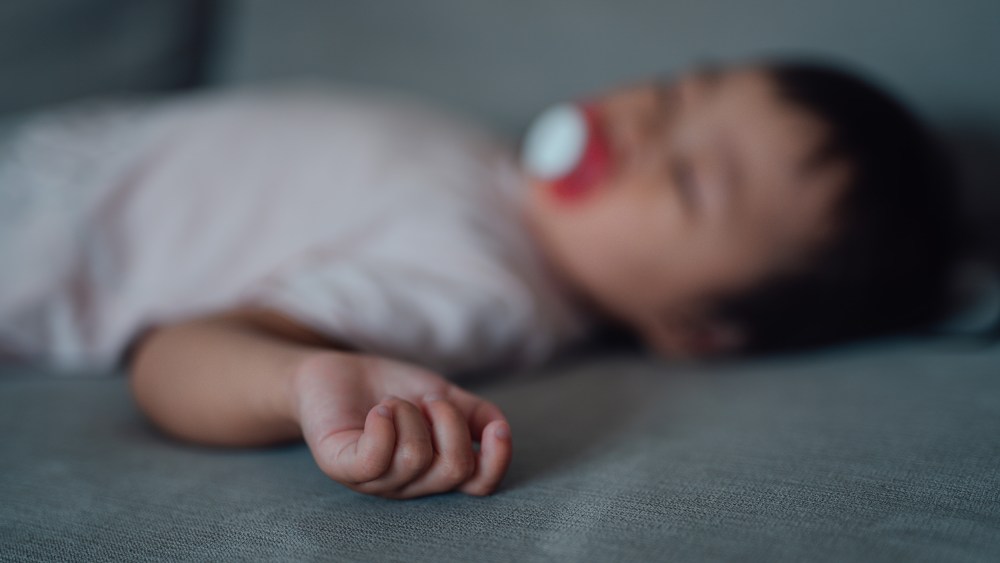 A sleeping baby, out of focus.