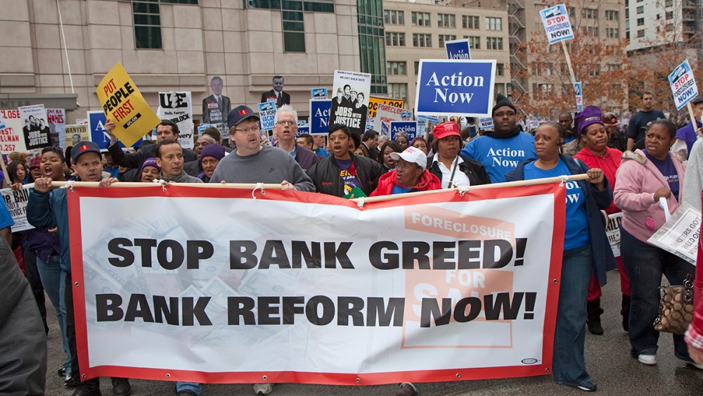 Unions, religious groups and community organizations in Chicago rally outside the conference of the American Bankers Association.