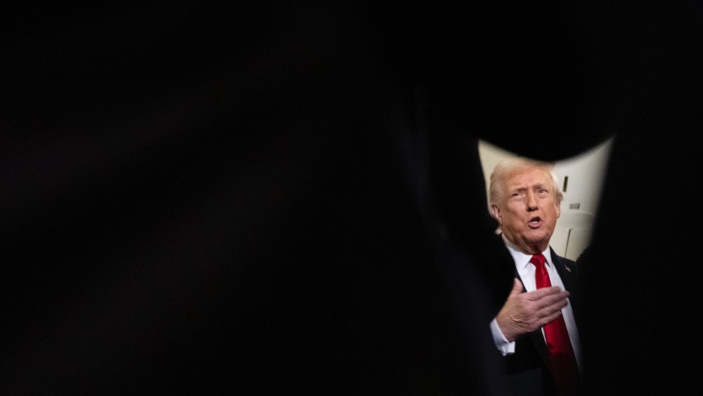 President Trump speaks to reporters on Air Force One.