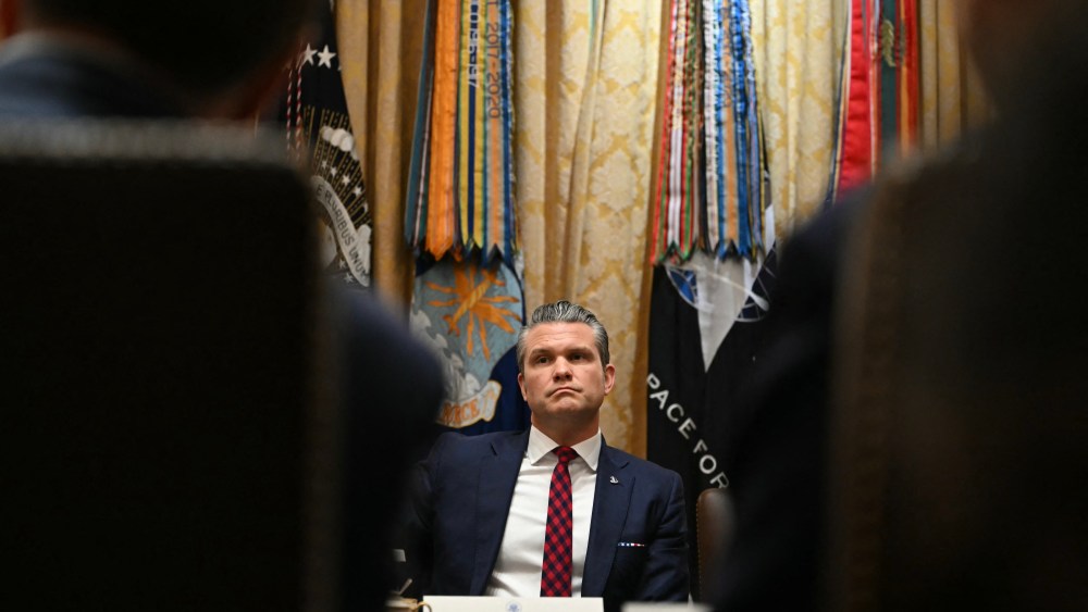 Secretary of Defense Pete Hegseth looks on during a Cabinet meeting hosted by President Donald Trump in the White House on Dec. 2, 2025.
