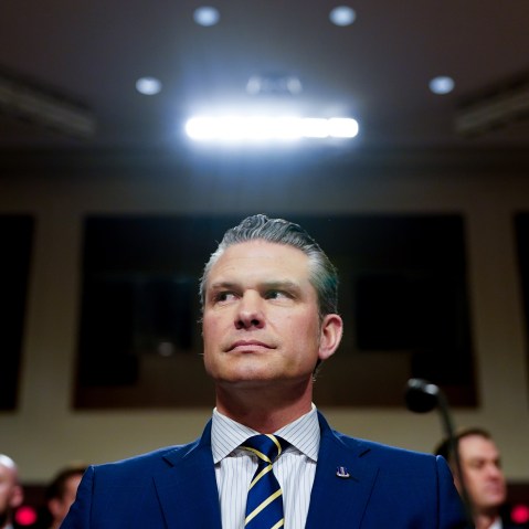 A light shines above Pete Hegseth, US secretary of defense, during a Senate Armed Services Committee hearing in Washington, D.C.