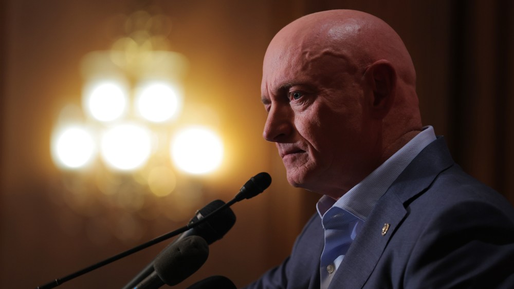Sen. Mark Kelly speaks at a news conference in the Capitol.